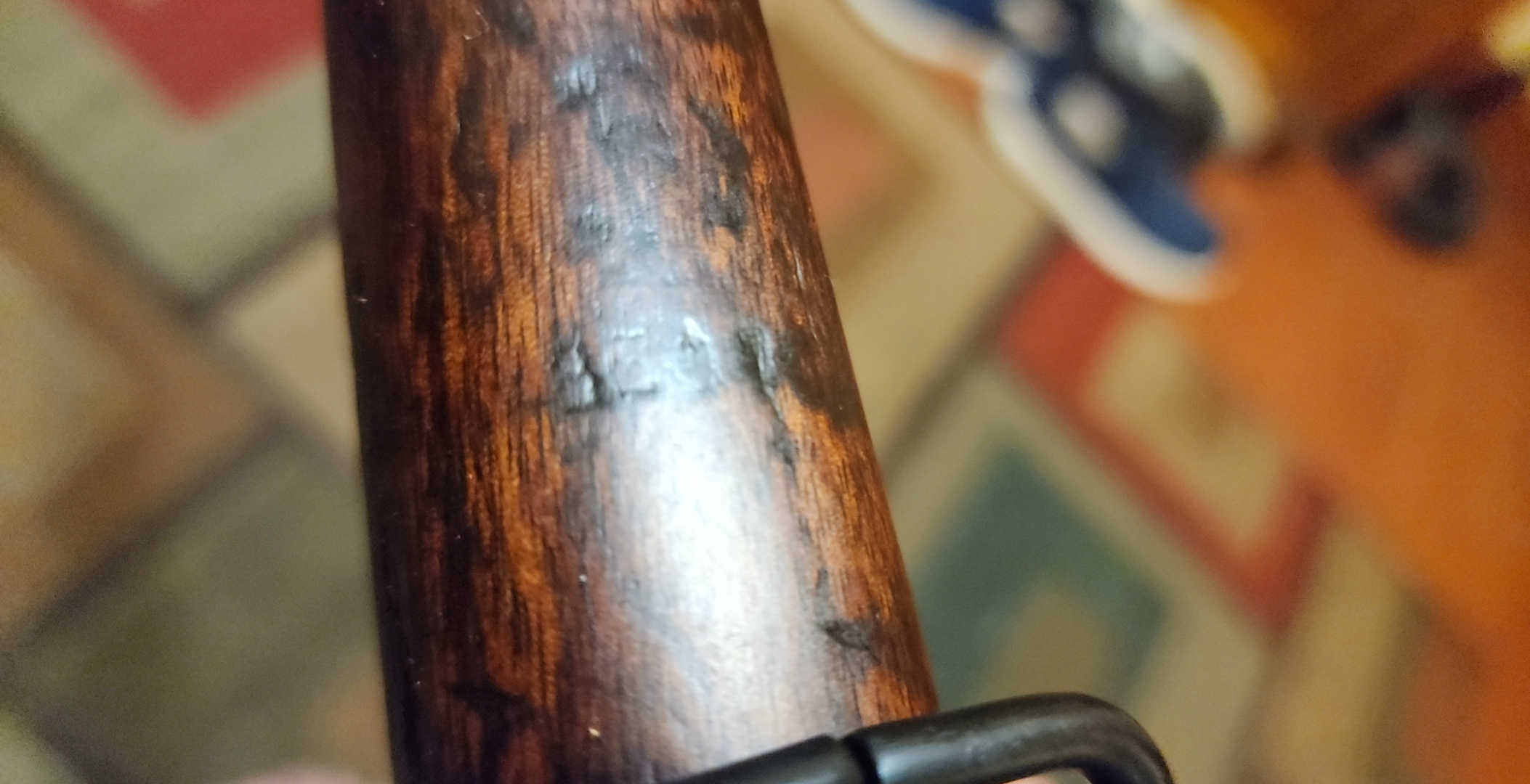 Serial number BE0123 stamped in the lower fore-end wood
