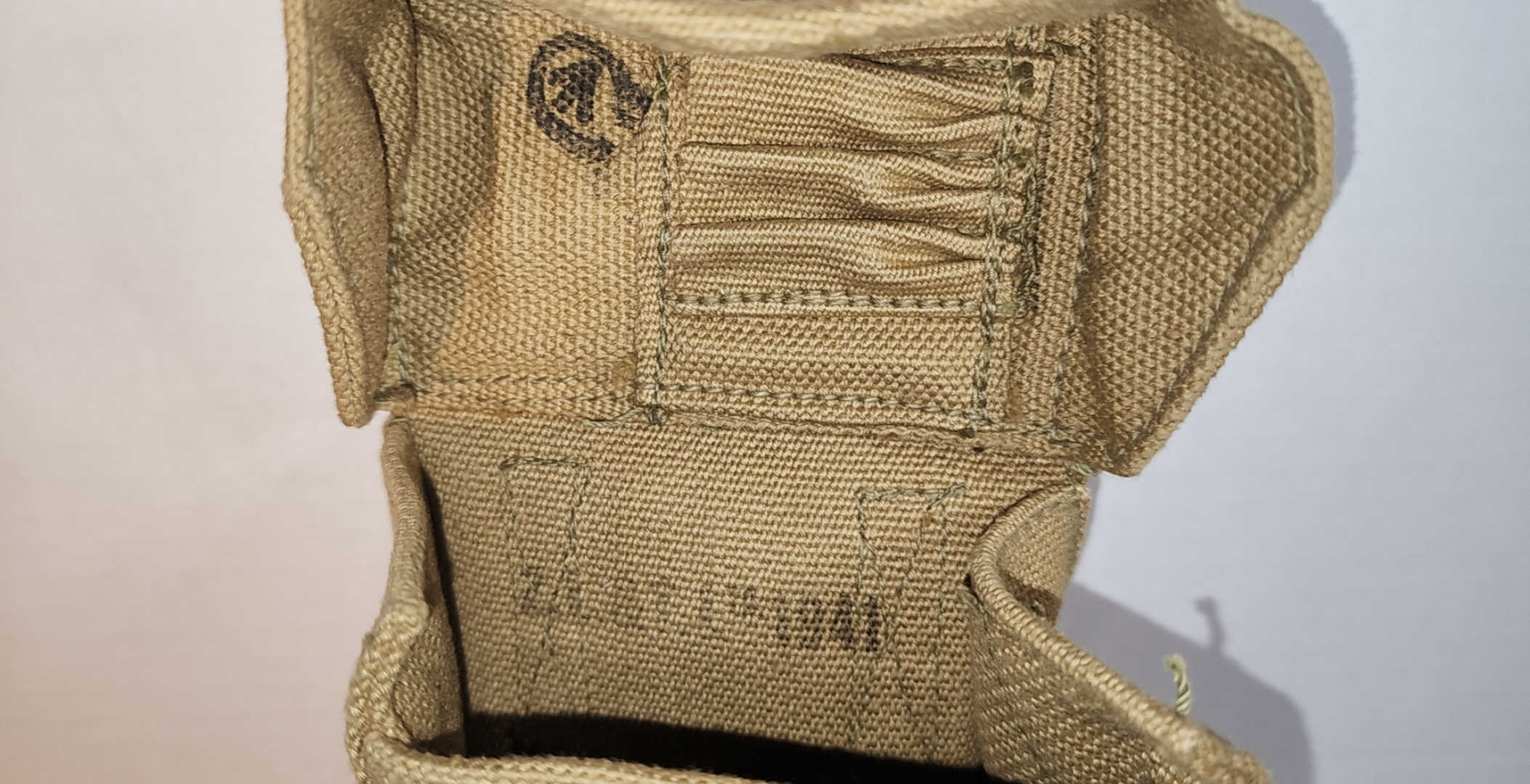 Interior of Z.L.&T. Ltd utility pouch dated 1941 with cartridge loops