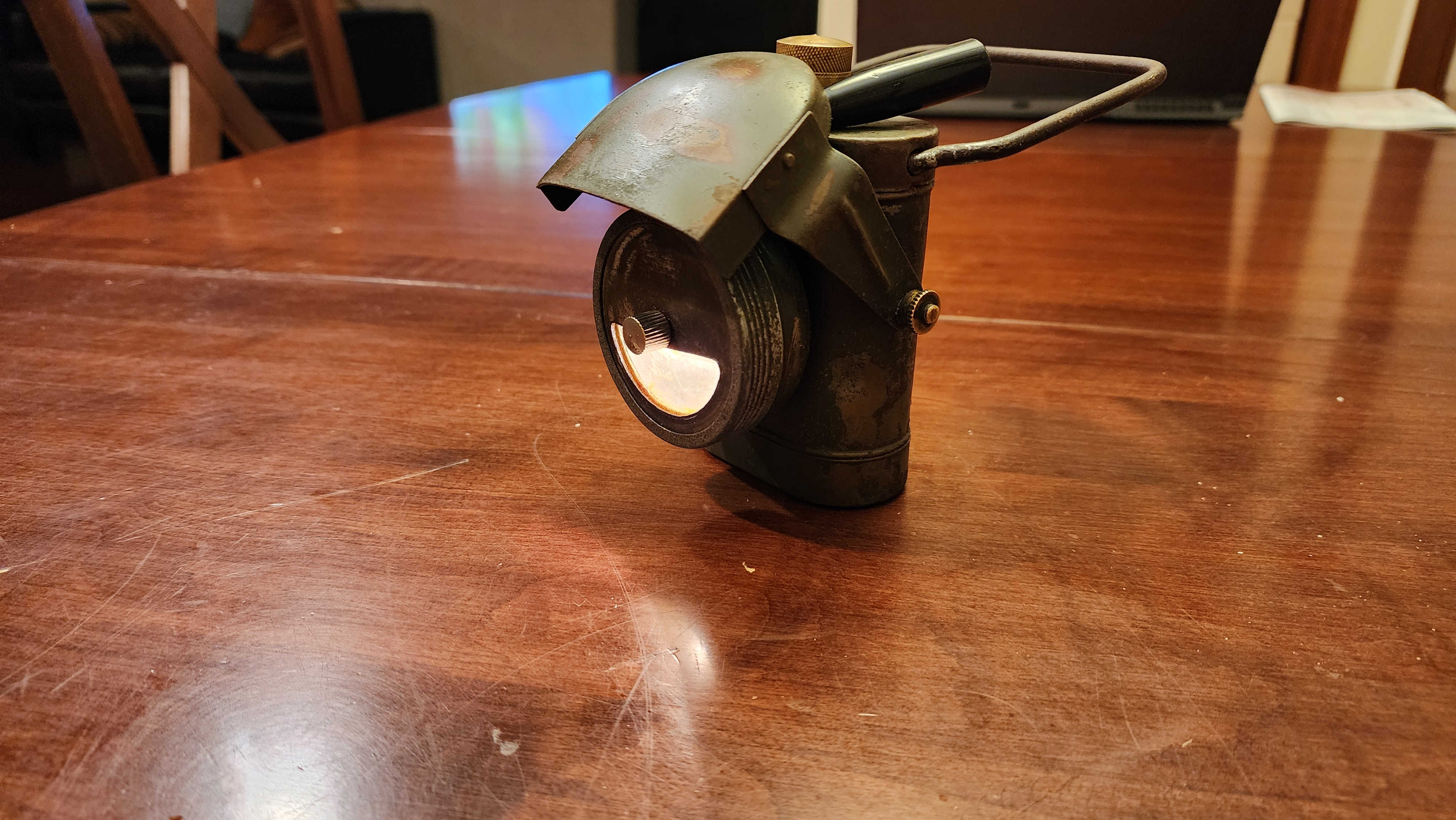 Blackout lamp after restoration, hood open with lamp lit