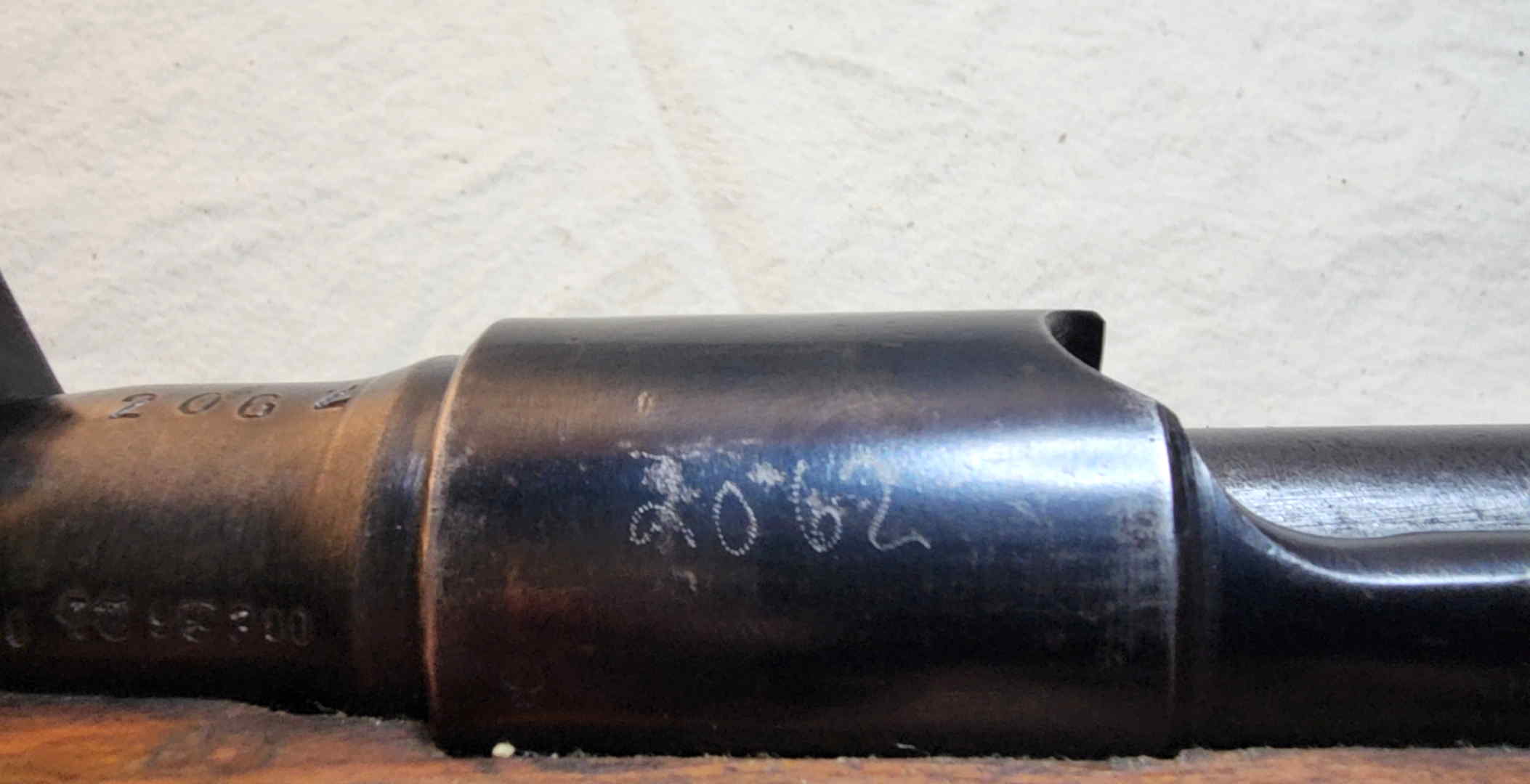 Receiver ring with electro-penciled number 2062 and adjacent barrel markings