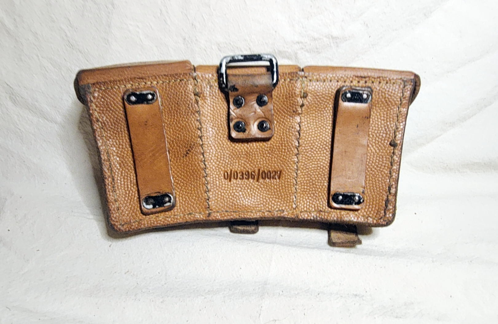 Rear view of Kar98k ammunition pouch with riveted belt loops, rectangular support ring, and 0/0396/0027 marking