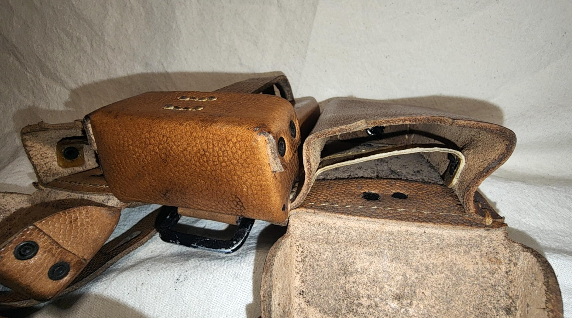 Opened Kar98k pouch compartment showing internal leather divider and unfinished interior surfaces
