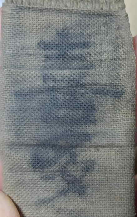 Faded Japanese owner name marking on the canteen strap, reading Kitamura