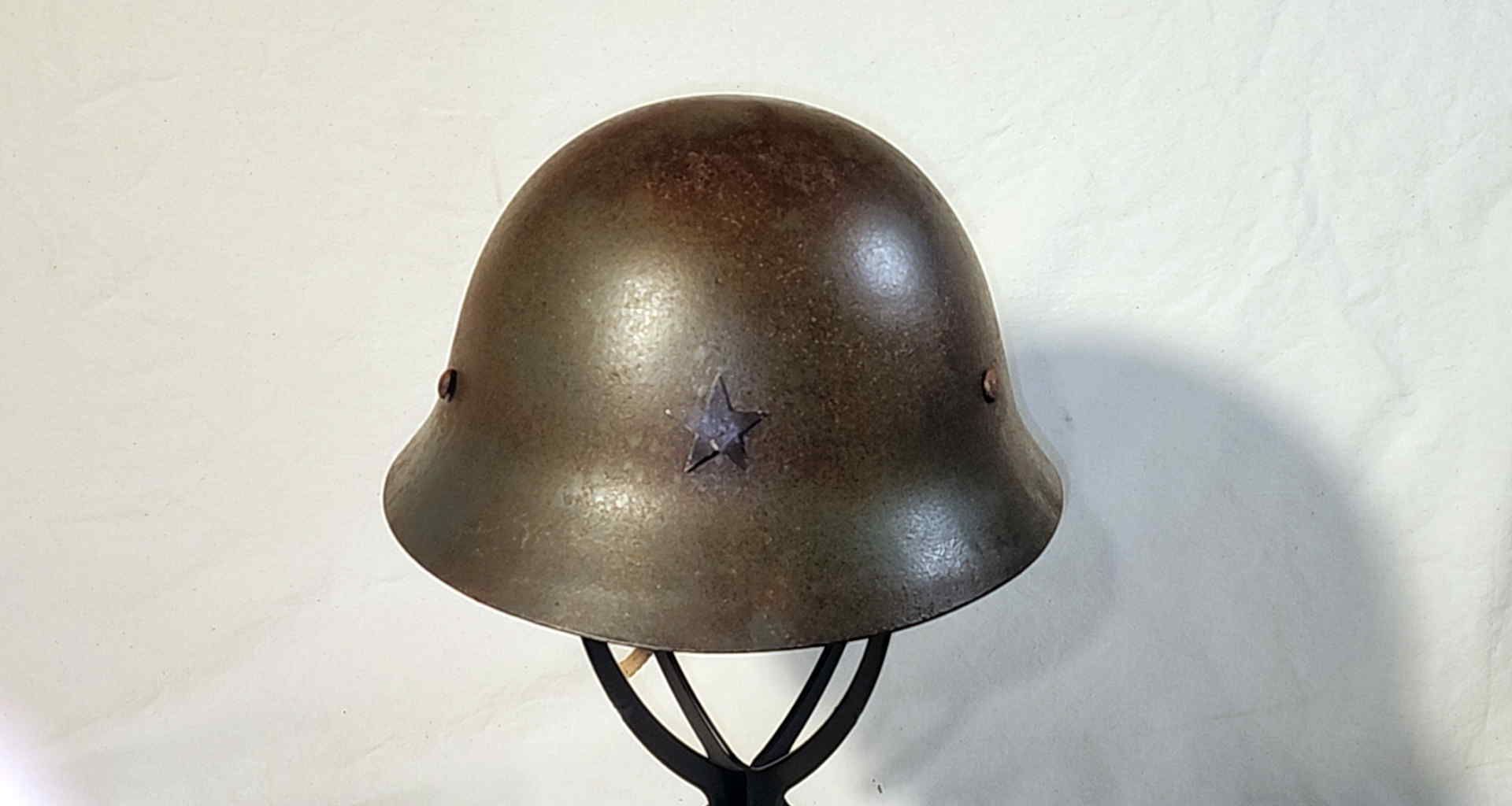 Front view of Japanese civilian home defense helmet showing five point star