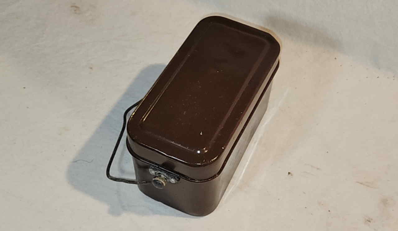 Top down view of Japanese officer mess kit closed with handle visible