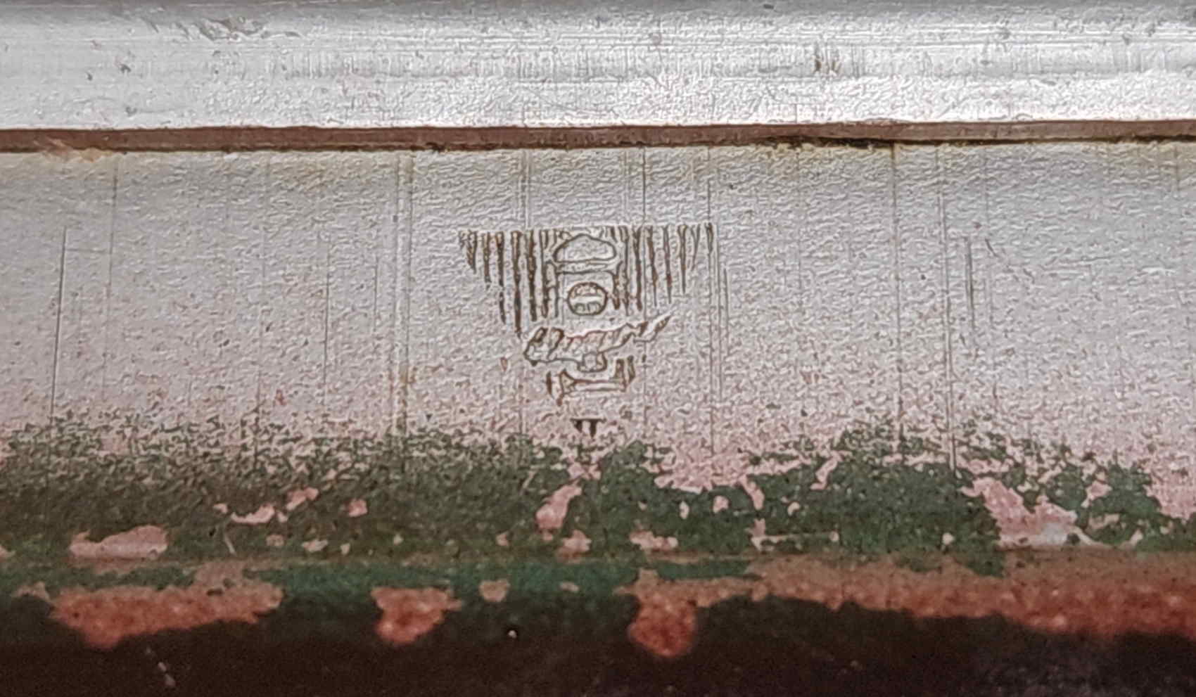 Close-up of triangular maker's mark inside the Japanese officer mess kit