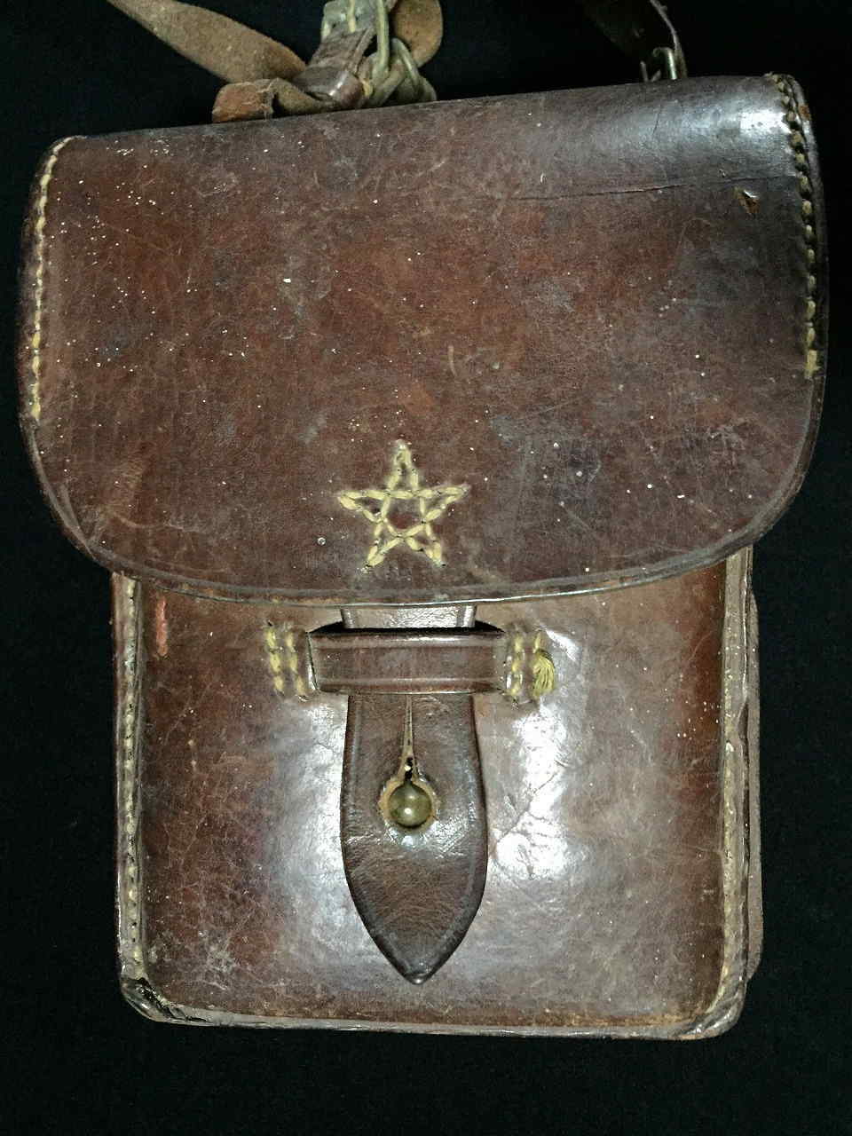 Front view of Imperial Japanese Army leather map or dispatch case showing stitched star and closure tab