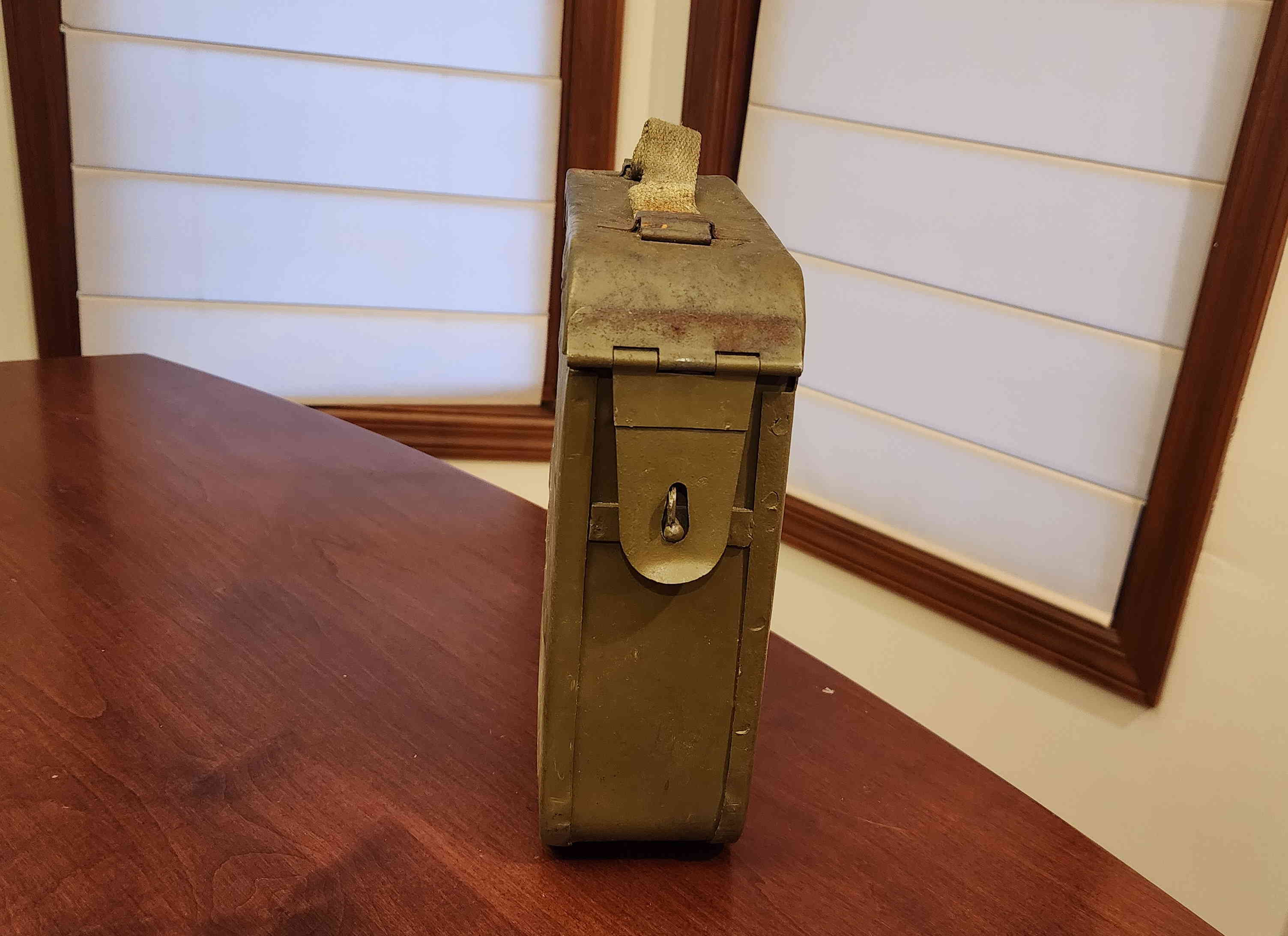 Side view showing latch and canvas carry handle