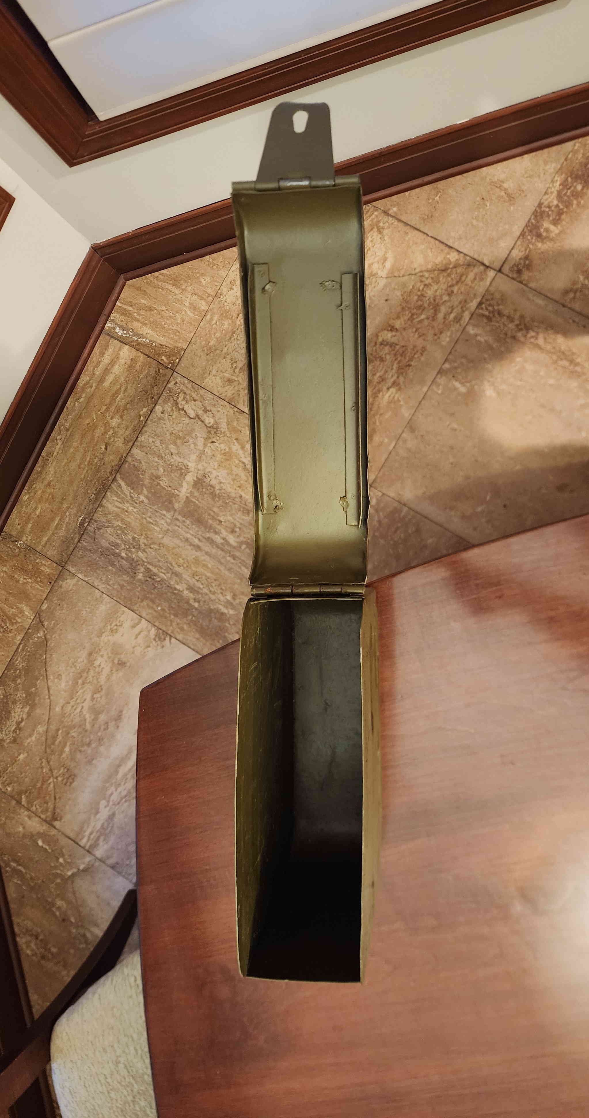 Open view showing interior cavity sized for a 250-round Maxim belt