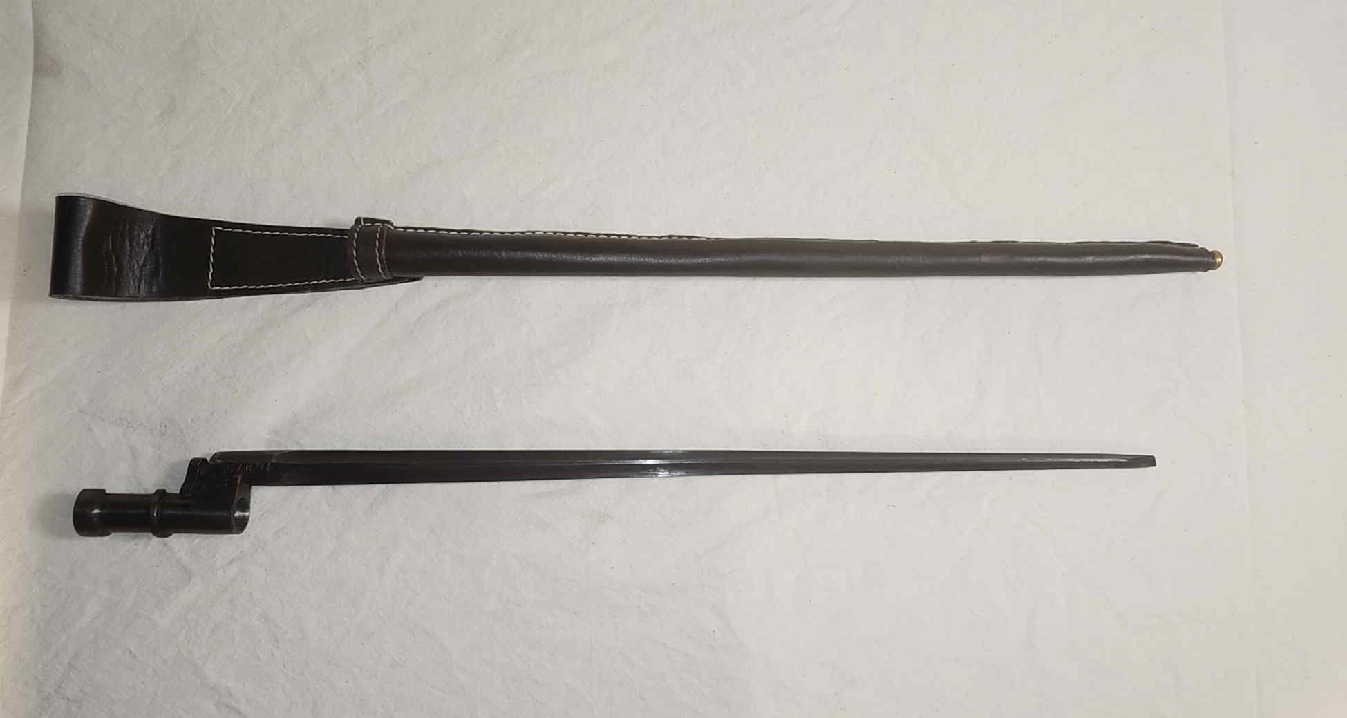 Mosin-Nagant M1891/30 socket bayonet displayed with brown leather brass tipped reproduction sheath