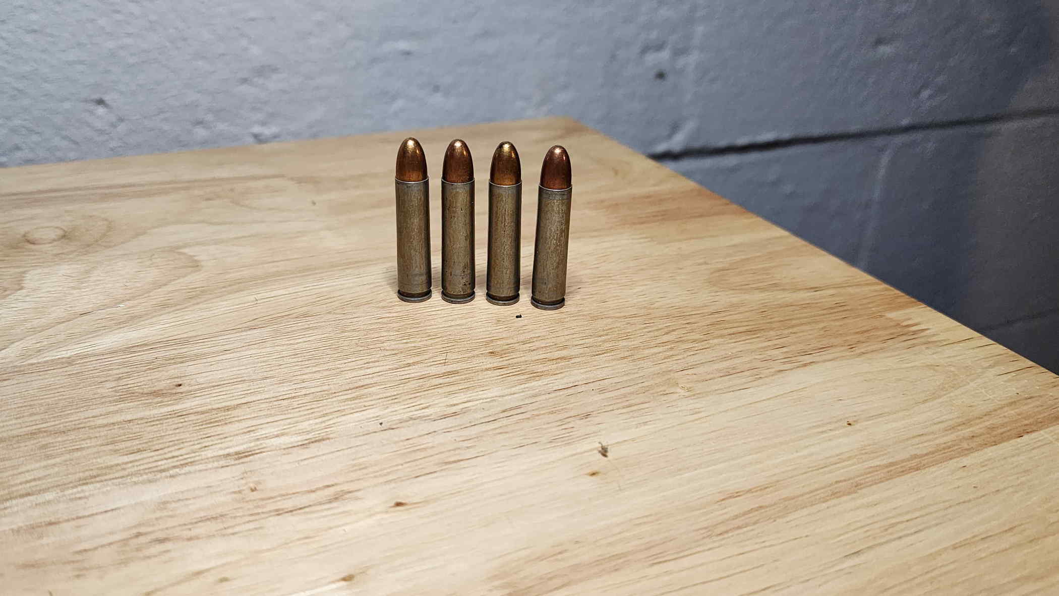 Four Evansville steel-cased .30 Carbine cartridges from 1943 and 1944