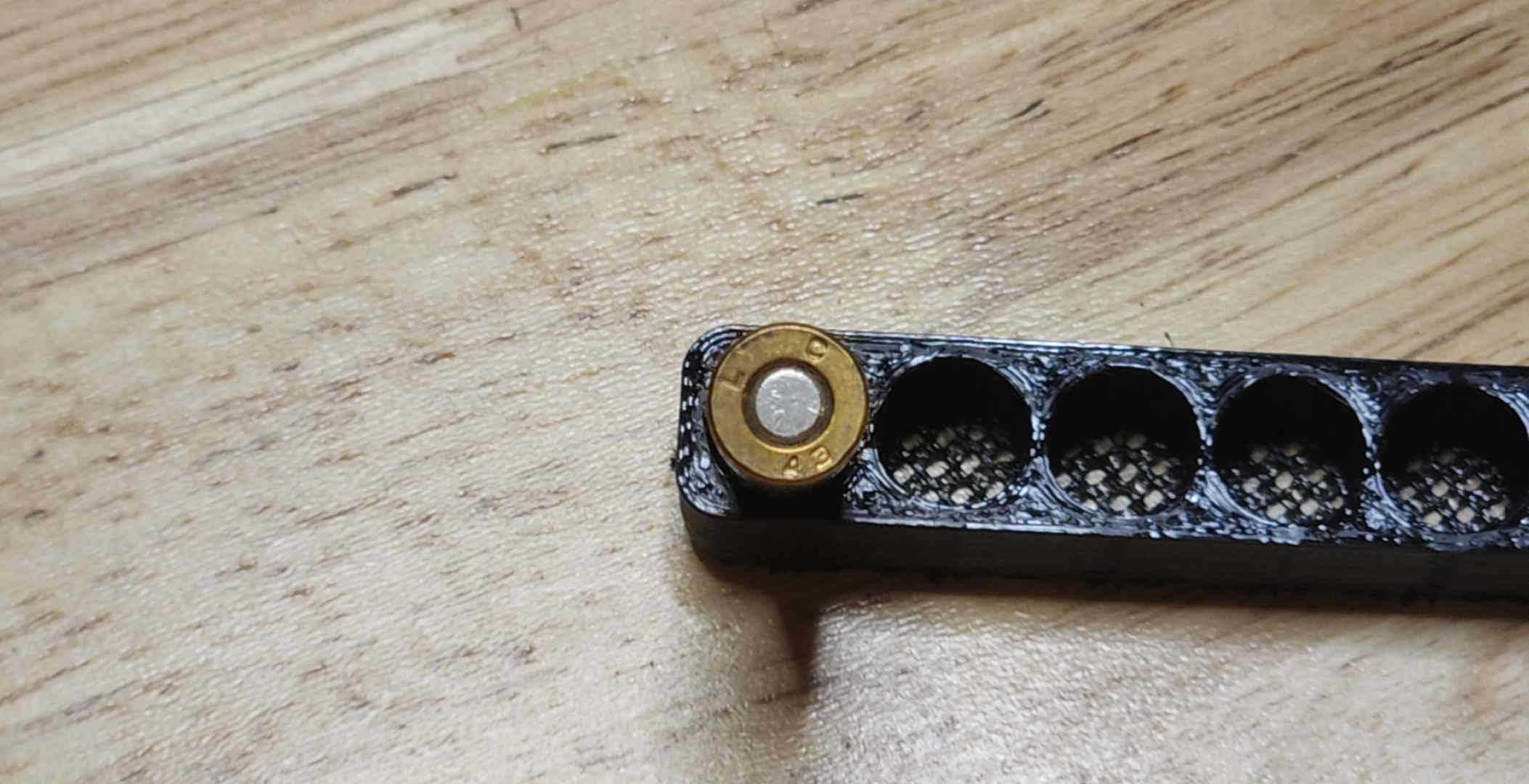 LC 43 headstamp on a brass-cased .30 Carbine cartridge