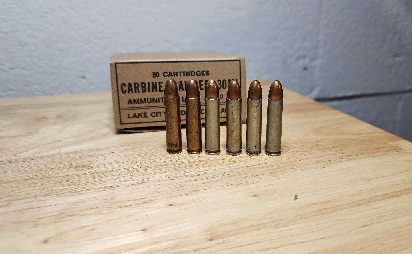 Group of Lake City, Western, and Evansville .30 Carbine cartridges with Lake City 50-round carton
