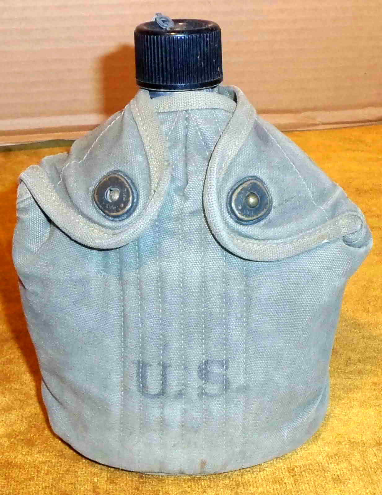 Front view of the 1942 U.S. M1910 canteen in its canvas cover