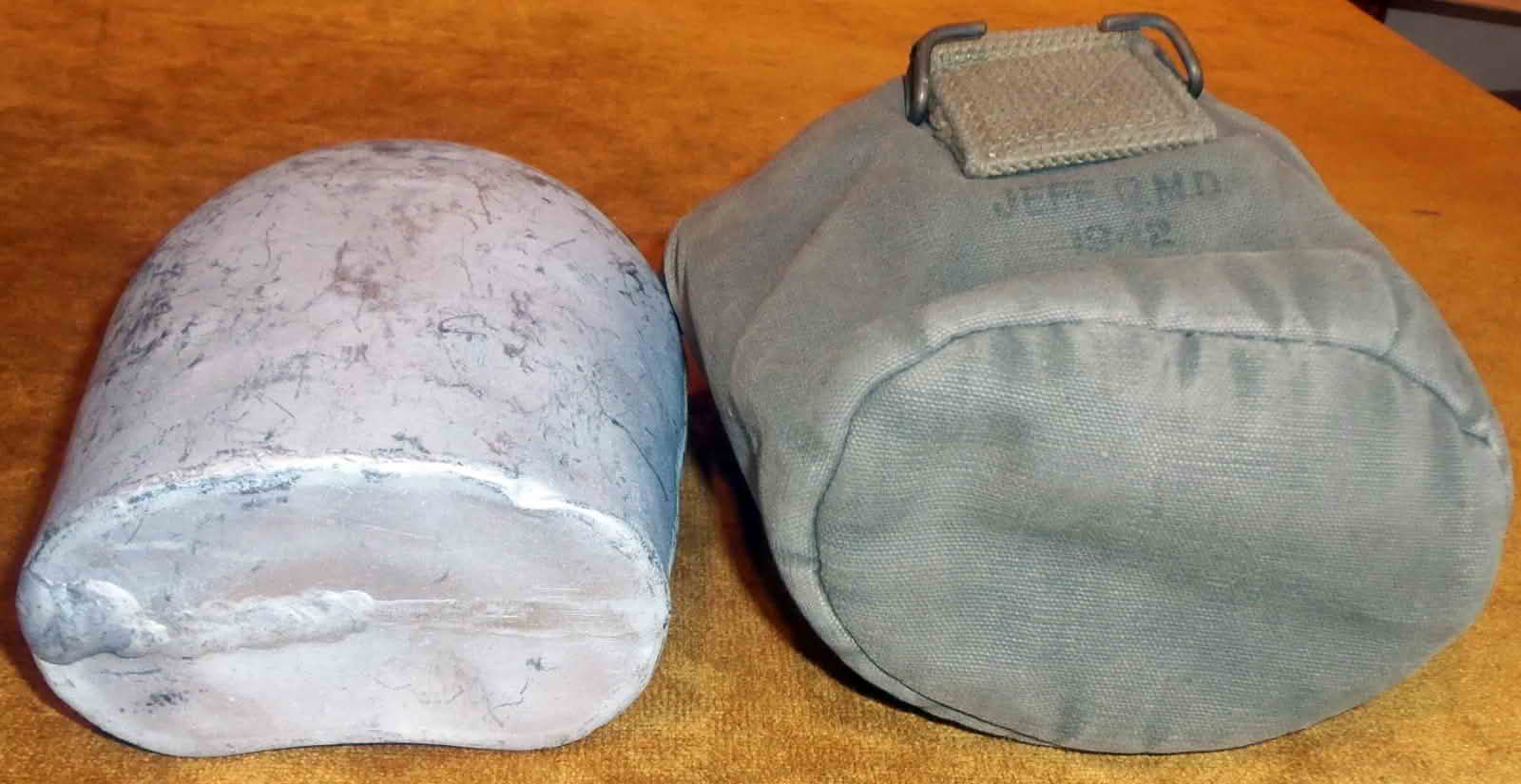 Bottom view of the aluminum canteen and cover showing horizontal seam and cover bottom