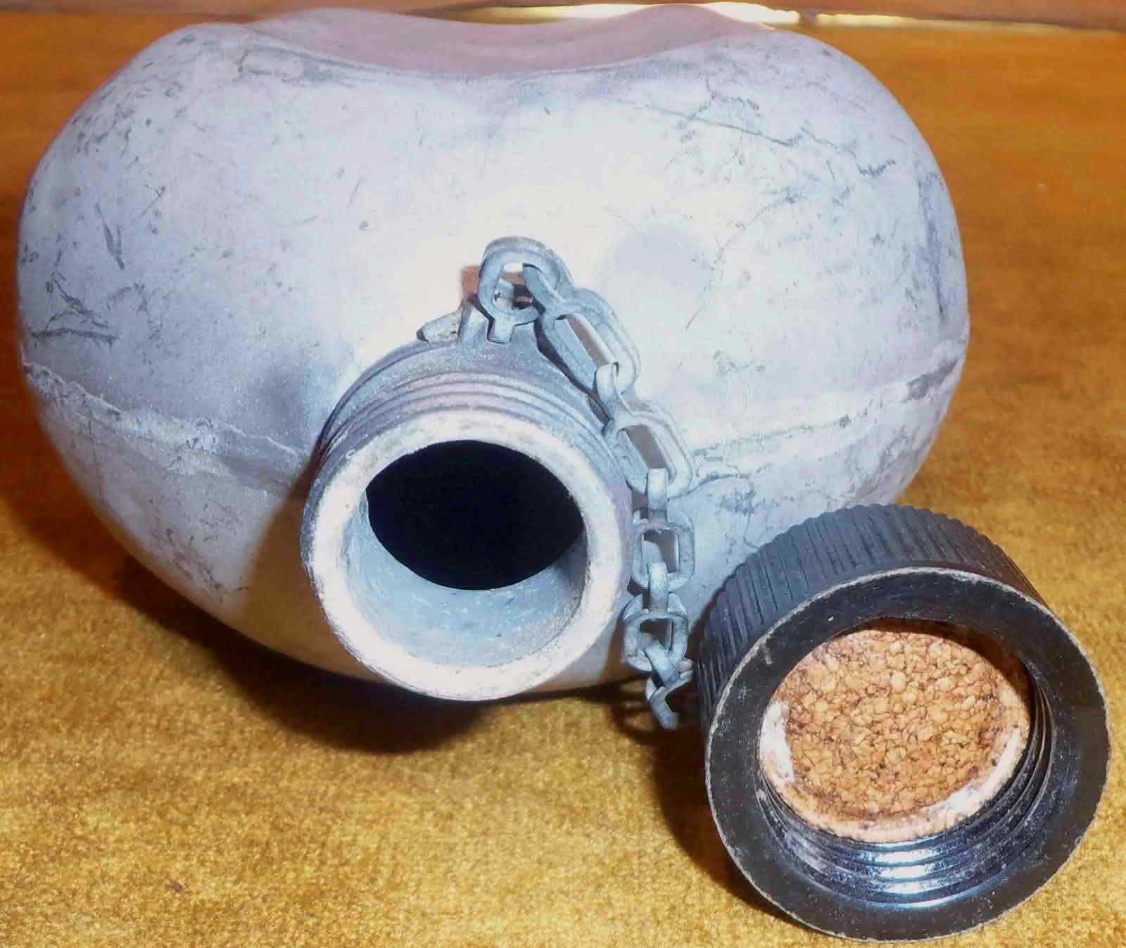Canteen cap removed showing cork seal and threaded mouth