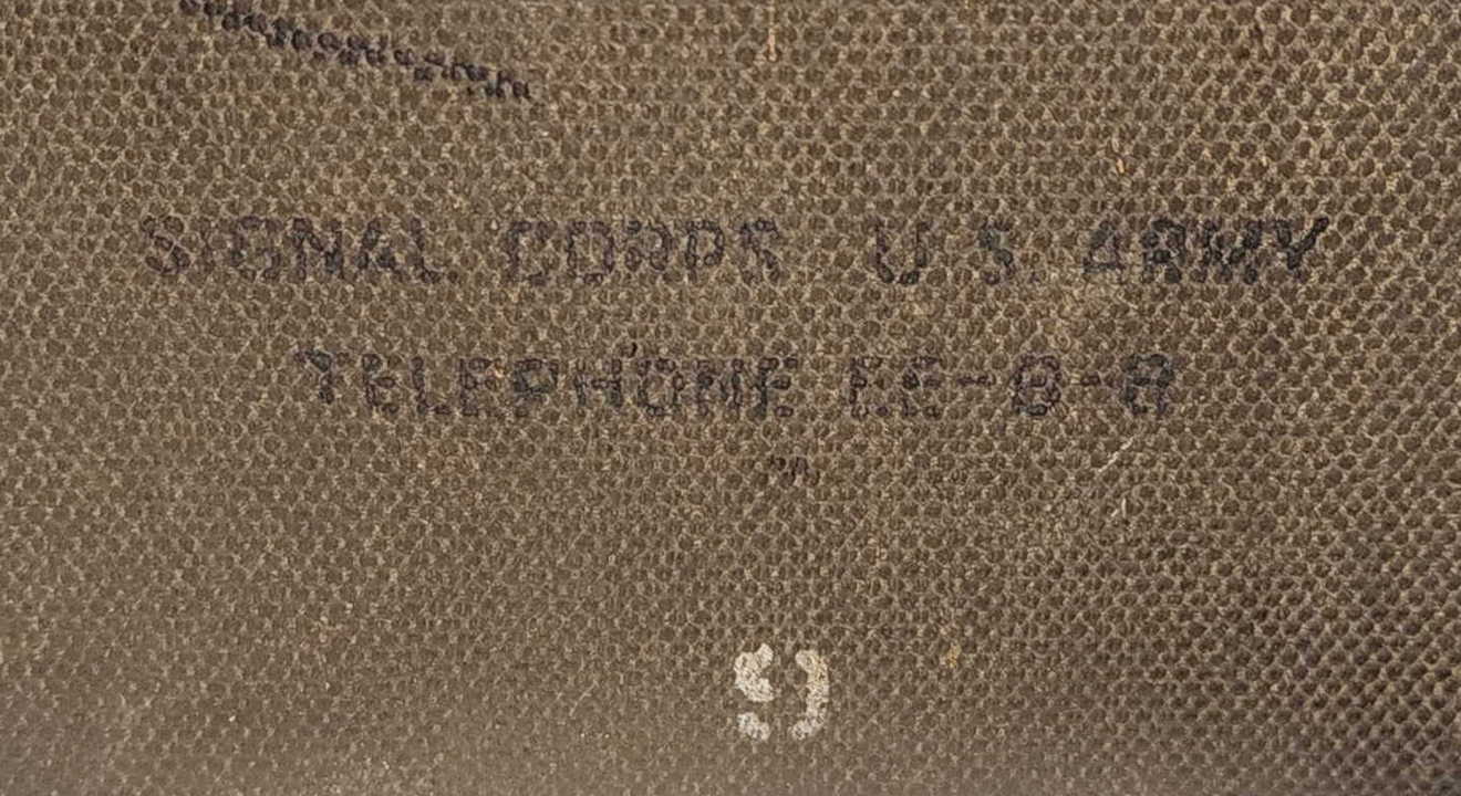 Front case stenciling on the EE-8-B canvas case reading SIGNAL CORPS U.S. ARMY TELEPHONE EE-8-B