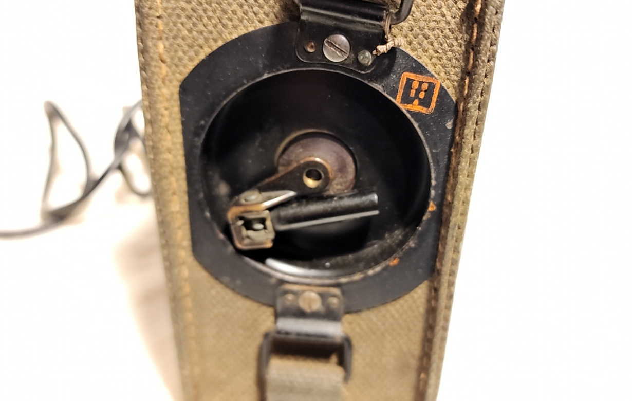 Magneto crank pocket detail on the EE-8-B case showing the crank opening and interior hardware