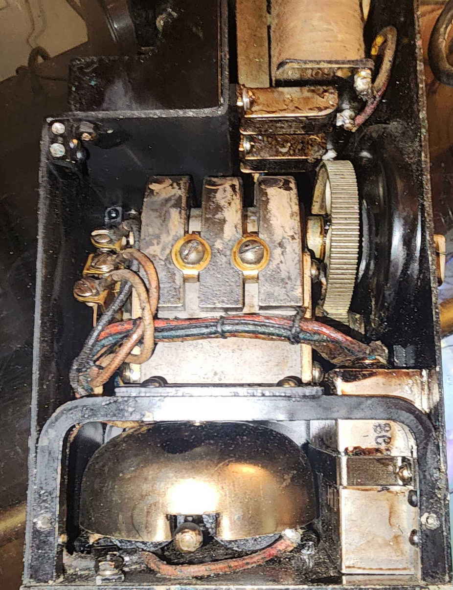 Interior view of EE-8-A showing bell, induction components, wiring, and magneto assembly during service