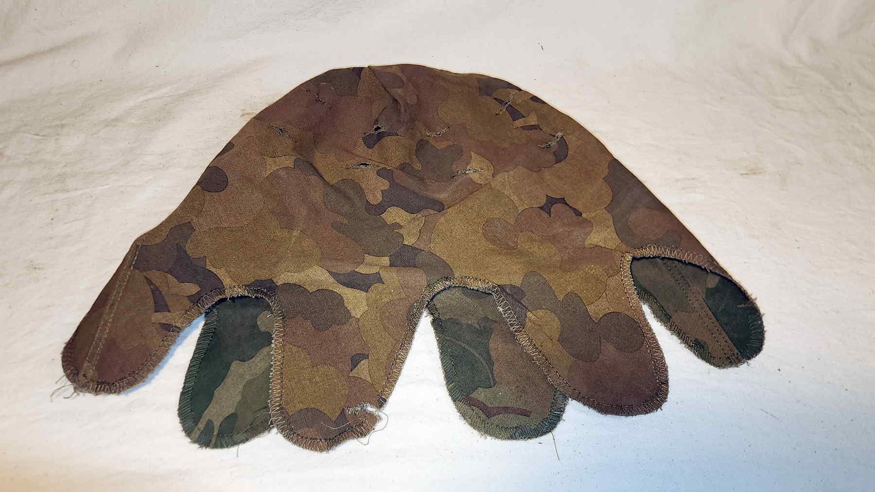 Reversible Mitchell pattern helmet cover with no visible contract label