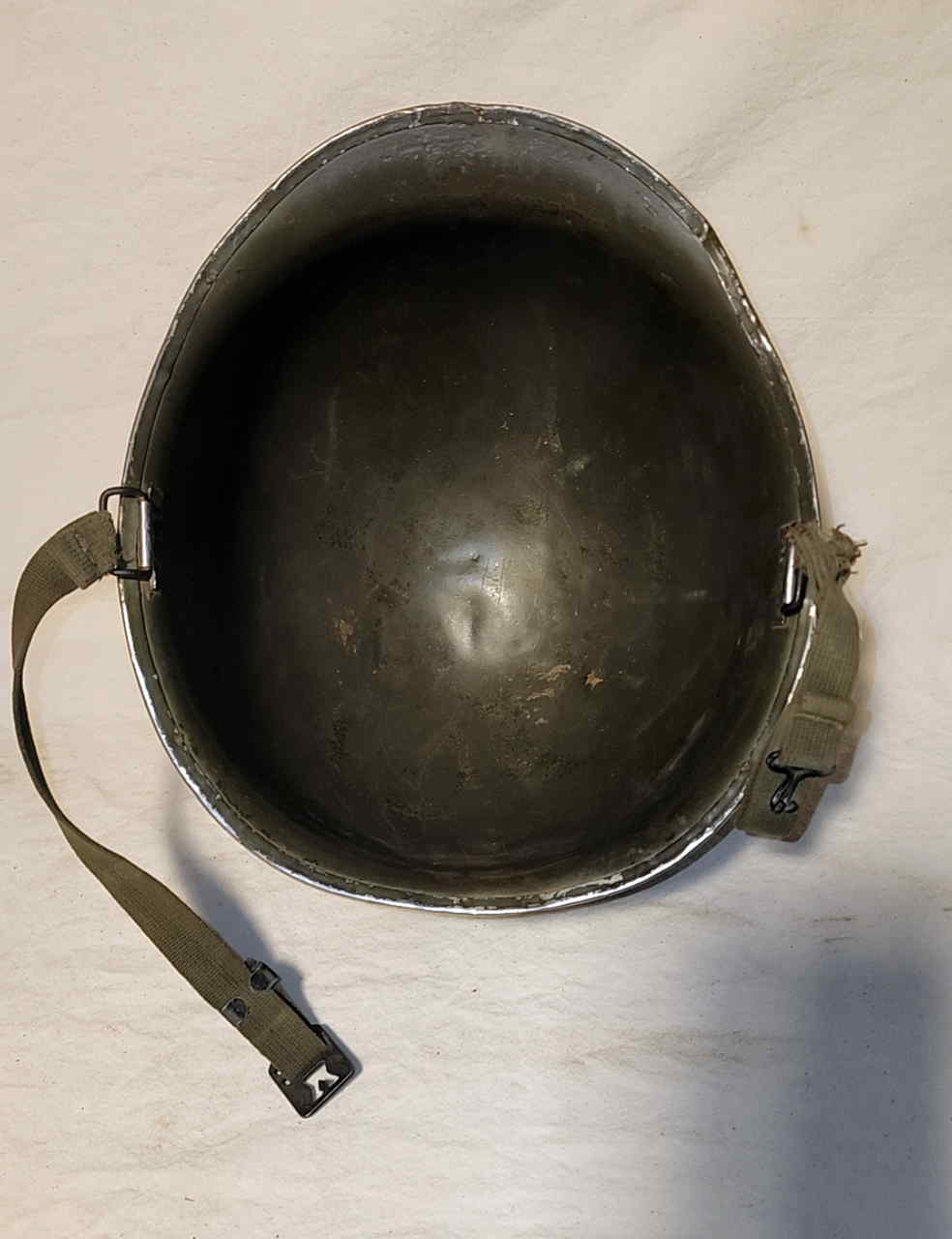 Top inside view of the steel shell showing straps and hardware