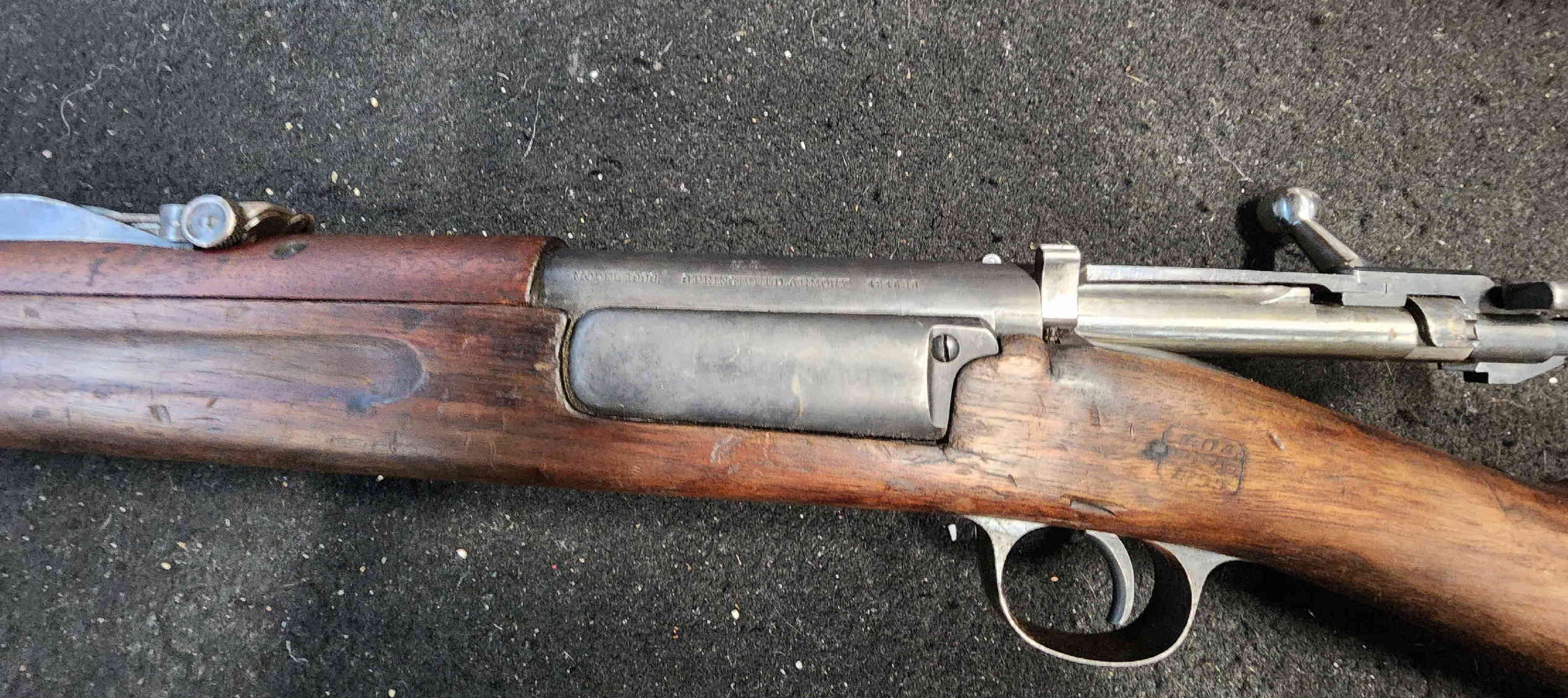 Close view of receiver markings and action area on Krag rifle