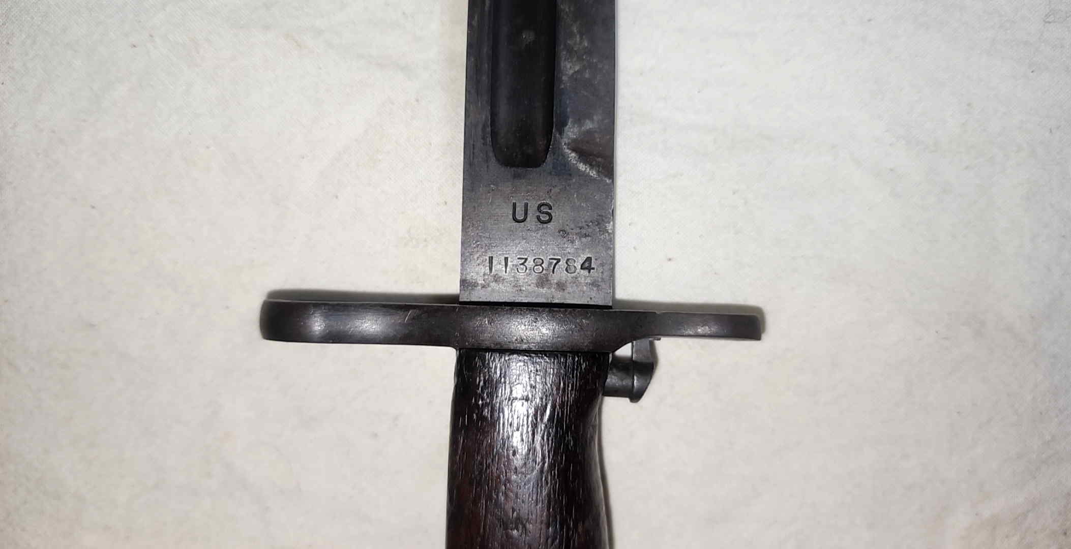 Close view of the US marking and serial number 1138784 on the Model 1905 bayonet