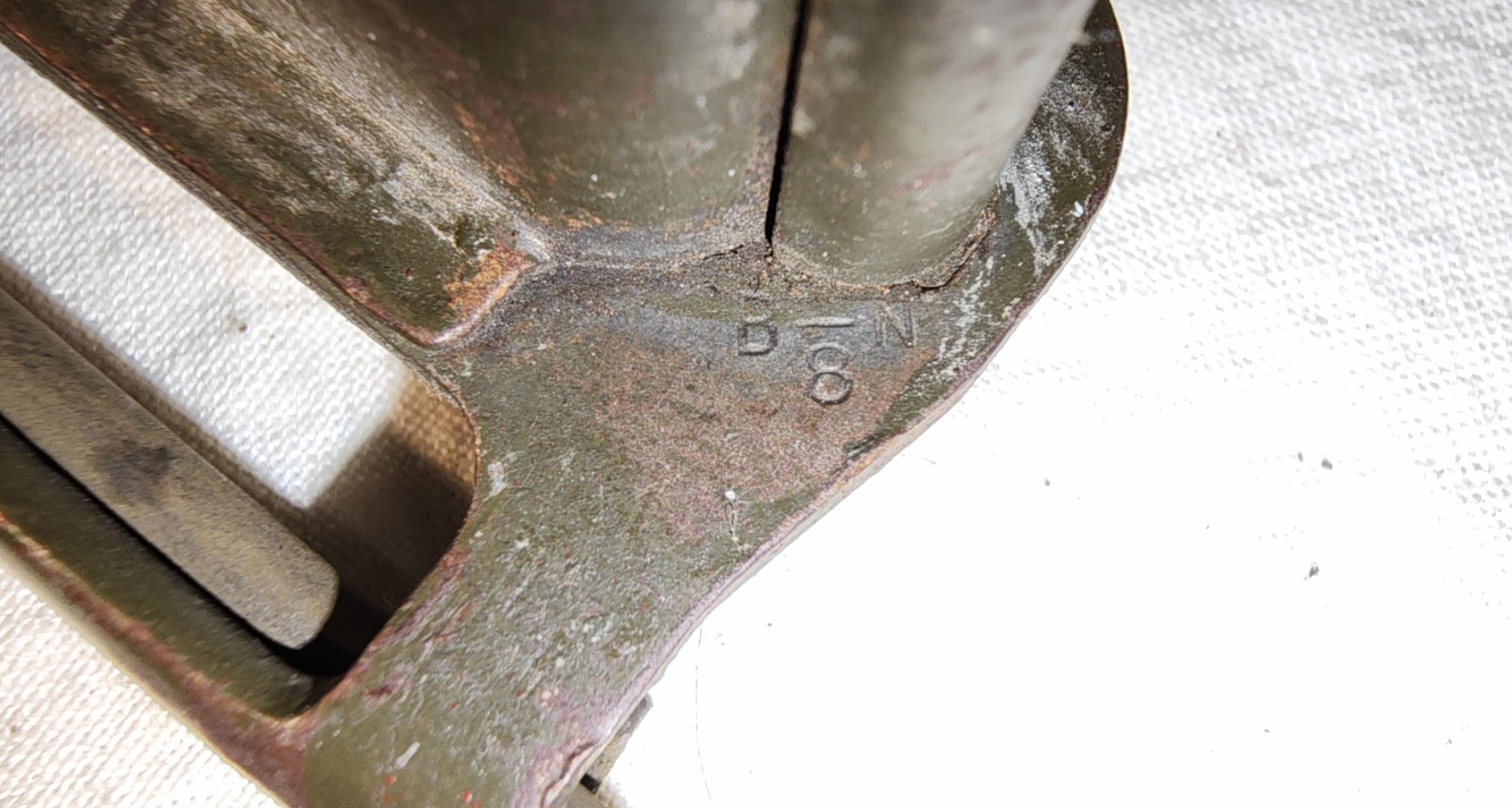 Underside of the steel scabbard throat with B over 8 and N to the right