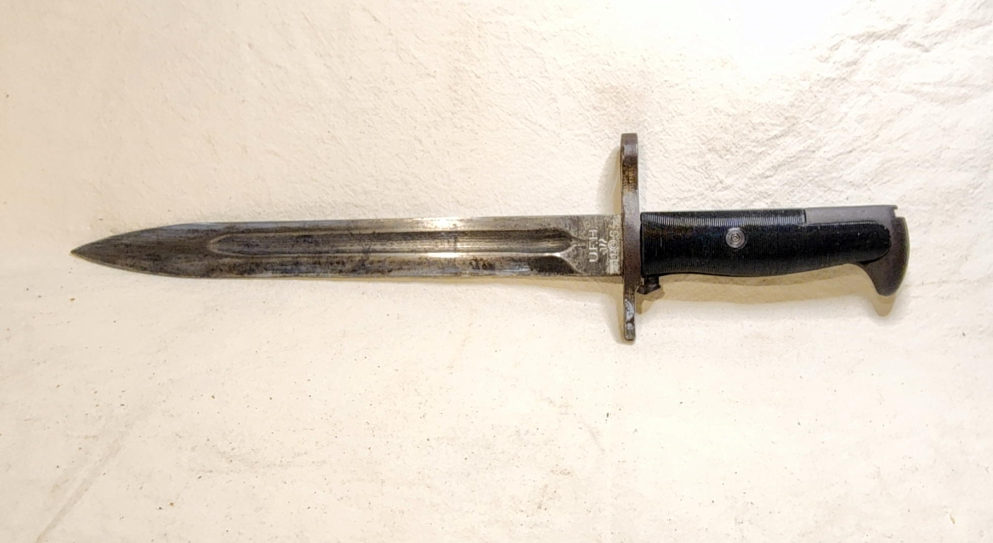 Complete Union Fork and Hoe M1 bayonet with ten-inch fullered blade and black grooved grips